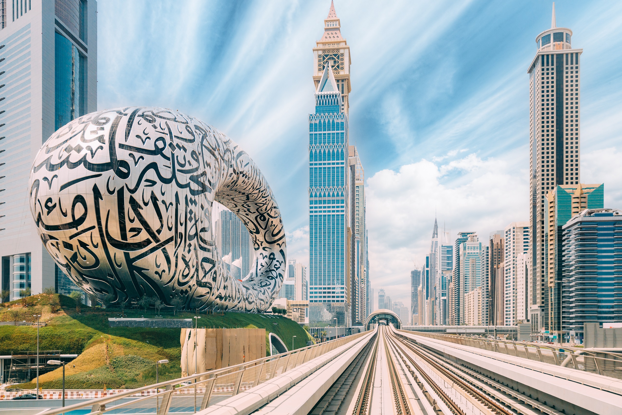 Dubai skyline with metro and Museum of the Future